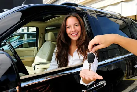 Woman purchasing a new car