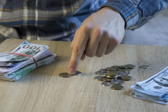 Counting out money for savings